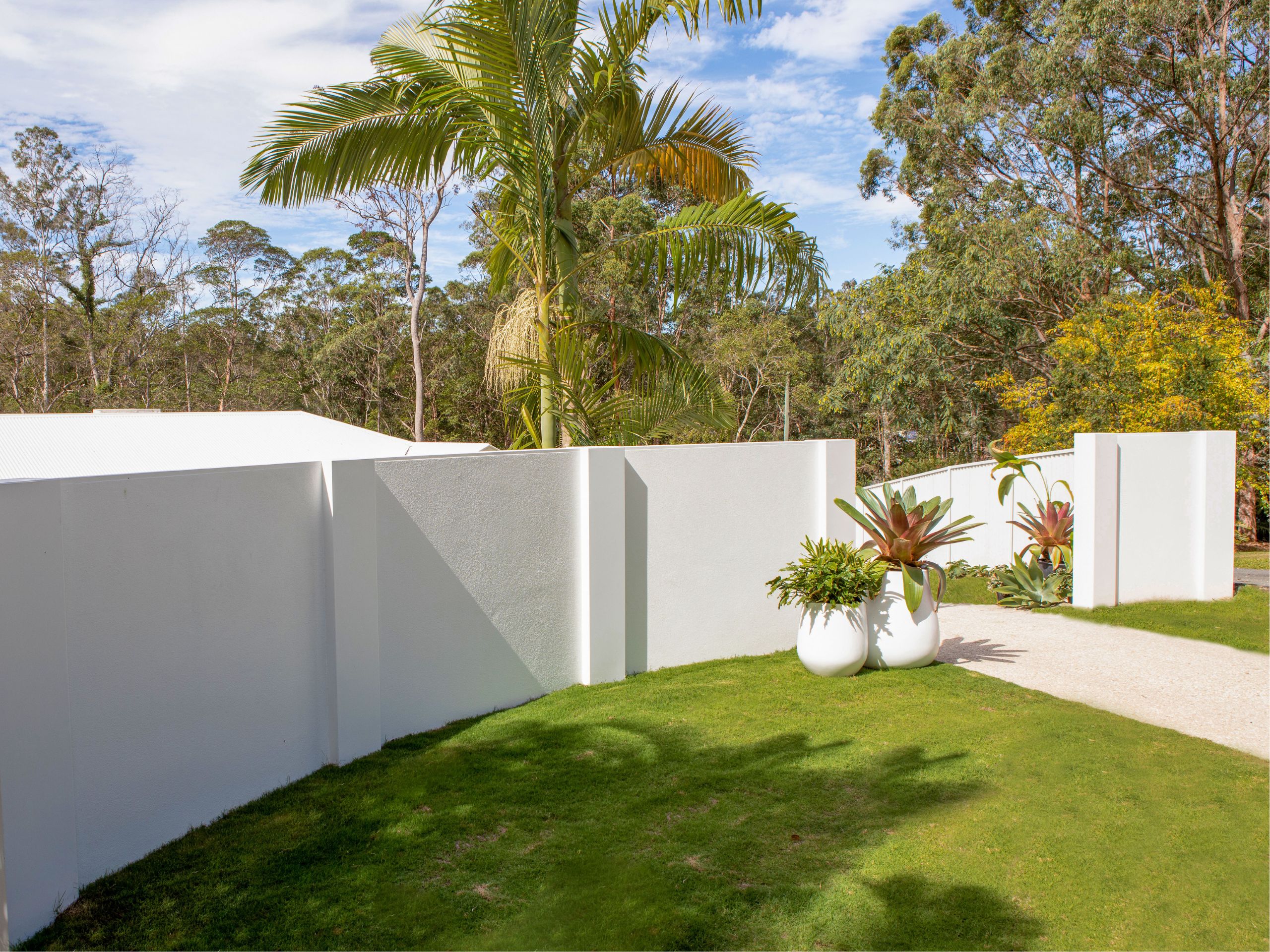 A textured boundary wall adds flair and interest