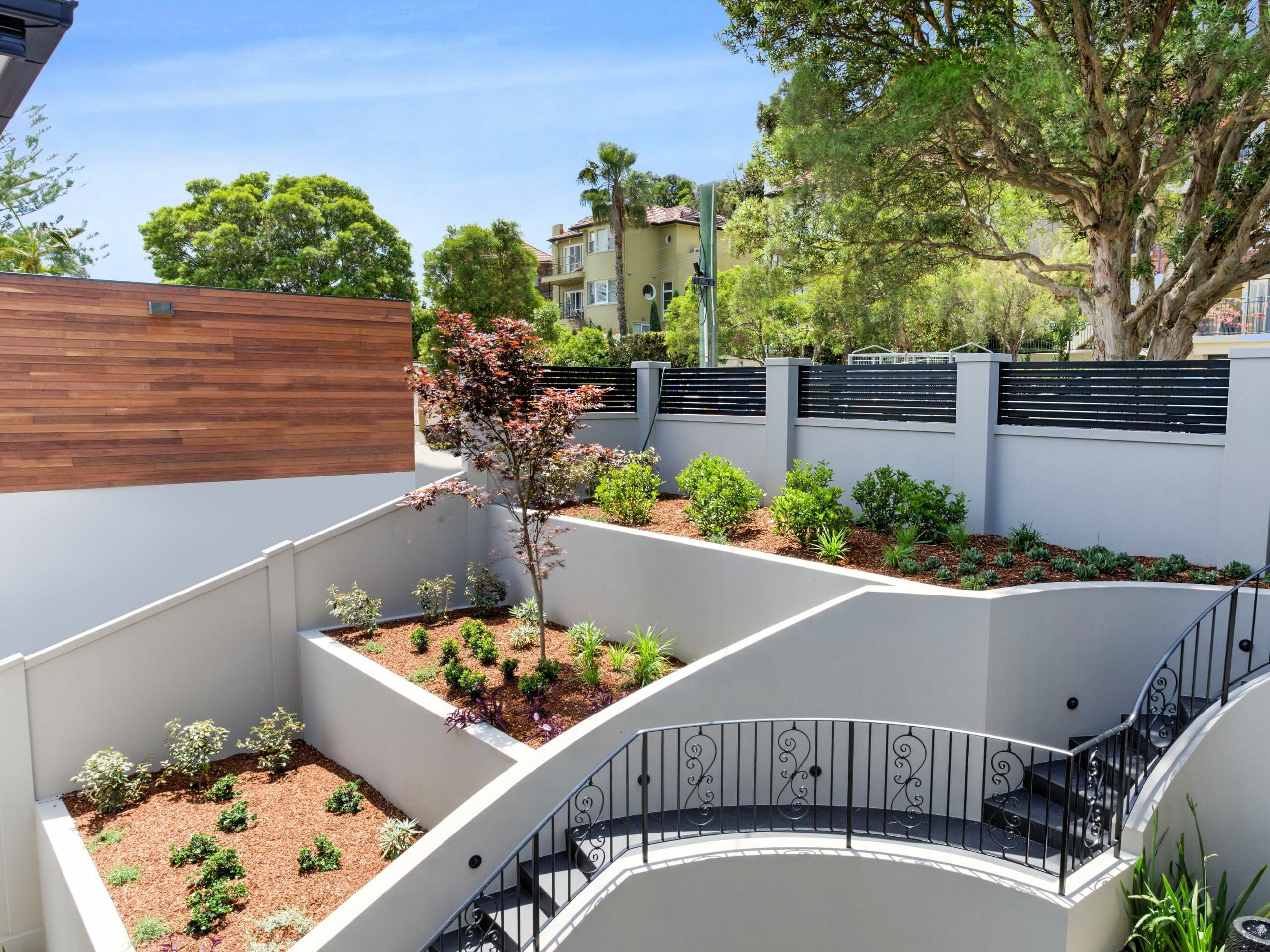 Creating a tiered backyard is an excellent way to maximise enjoyment of an uneven block