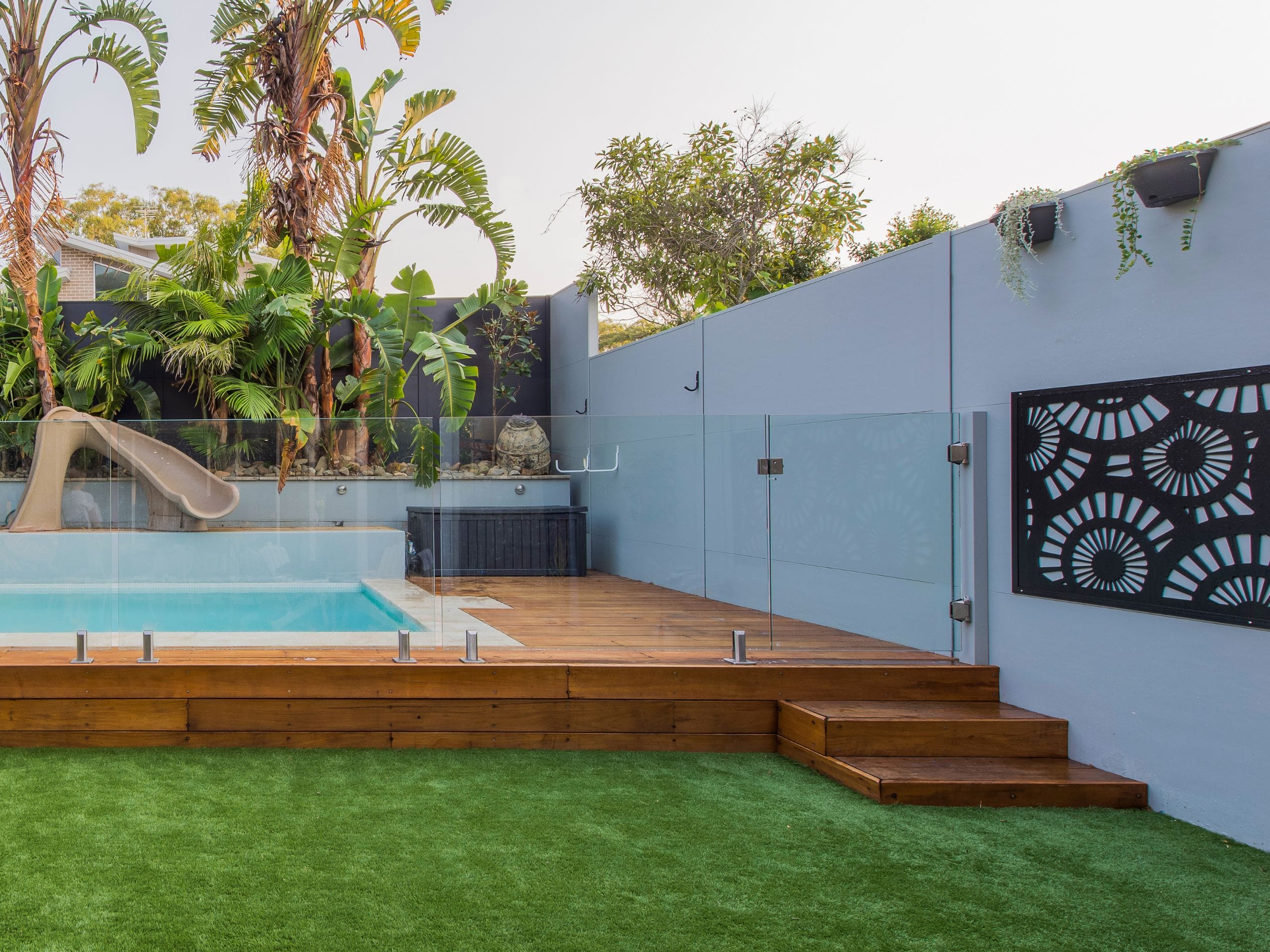An above ground pool is an ideal solution for a sloping block