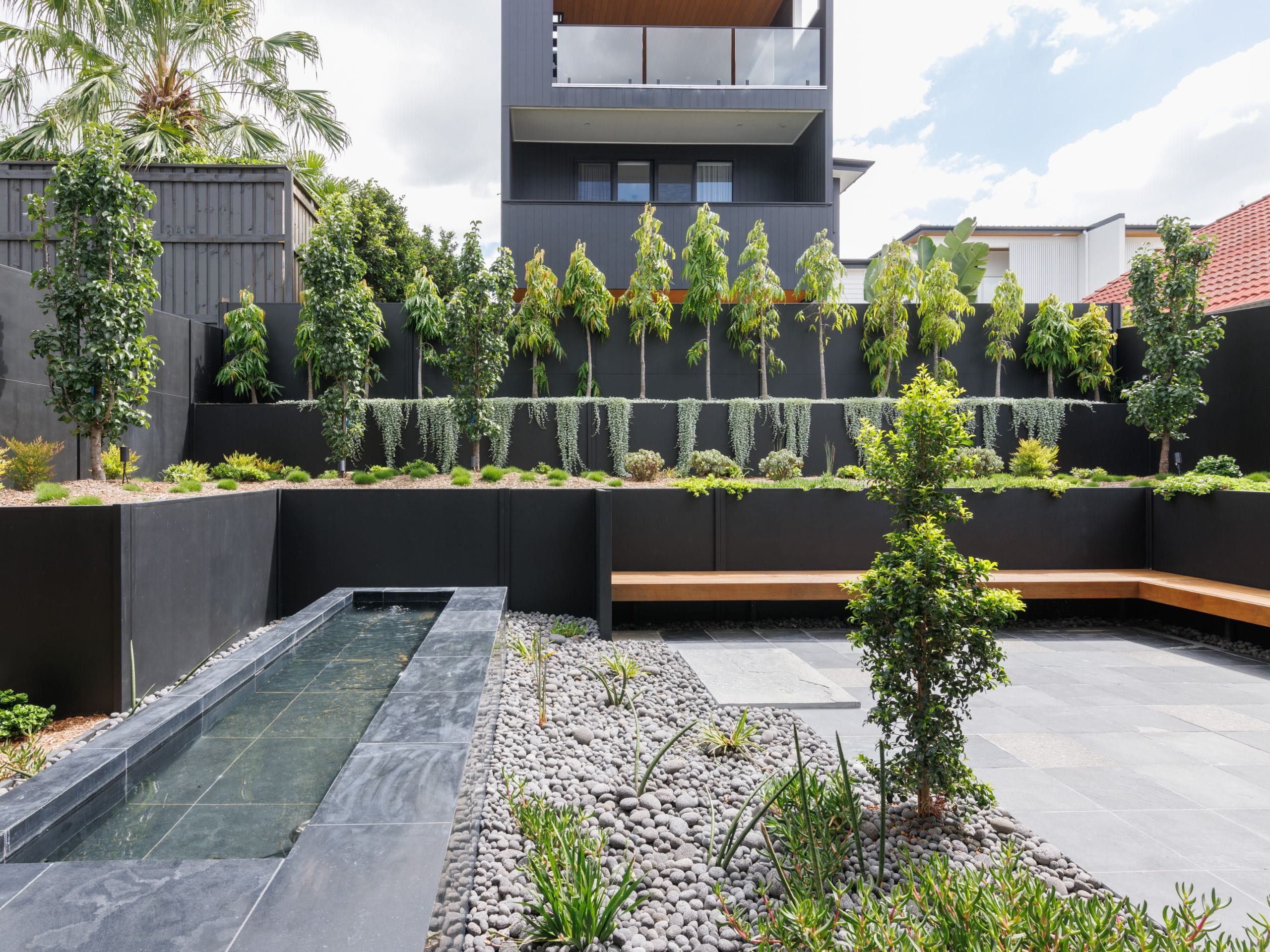A tiered backyard with retaining walls is an eye-catching alternative 