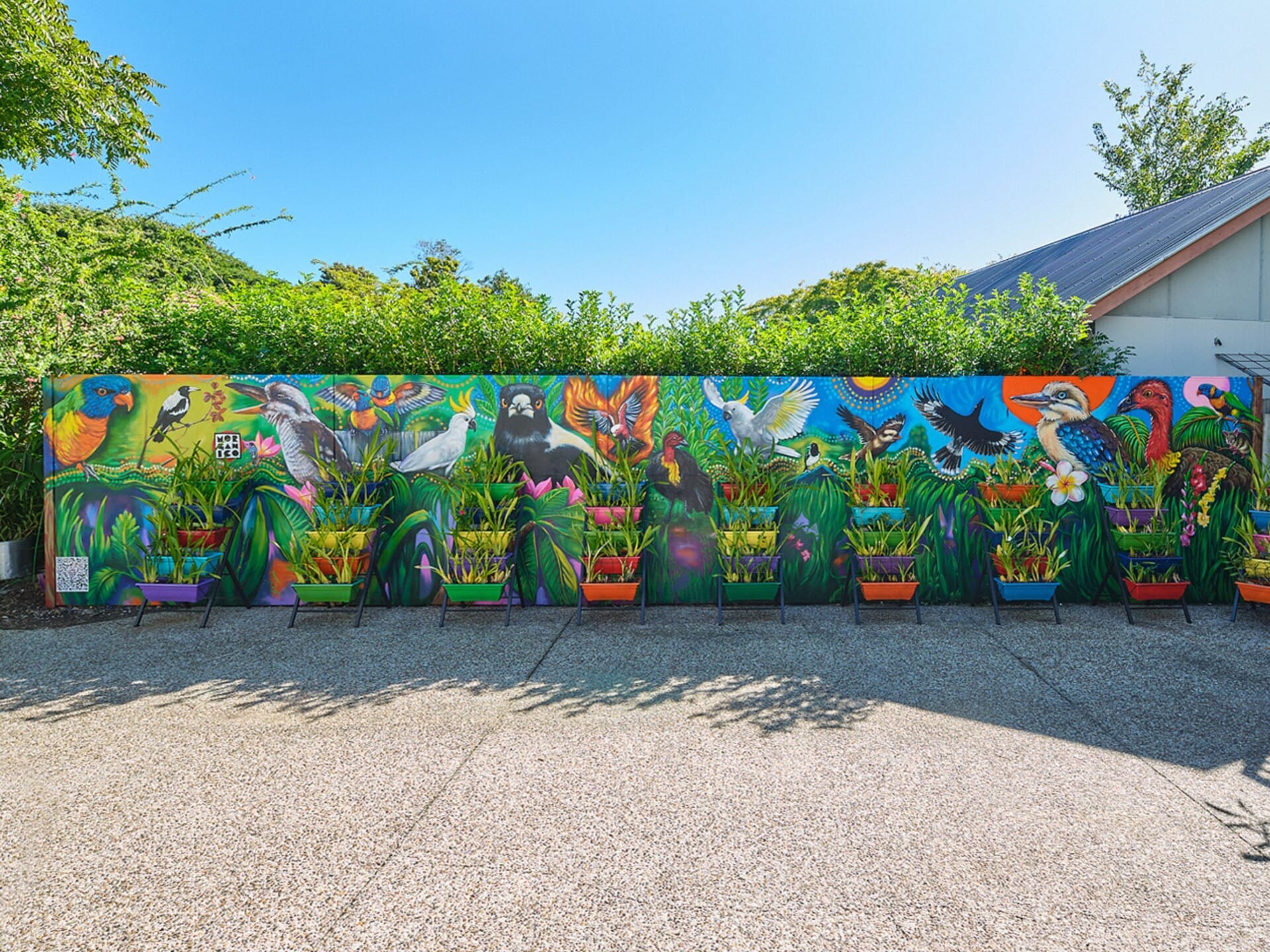A colourful mural wall completely transforms the outdoor space