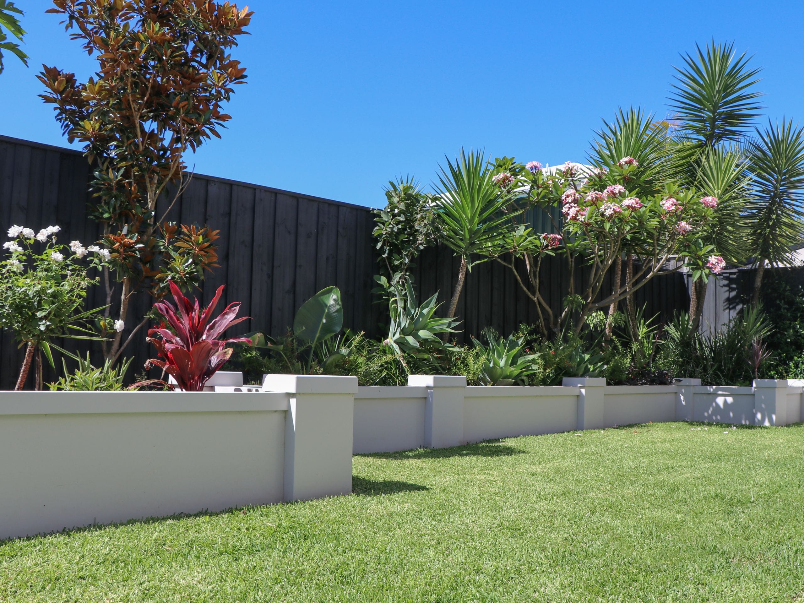 A raised garden bed is a functional and aesthetic feature