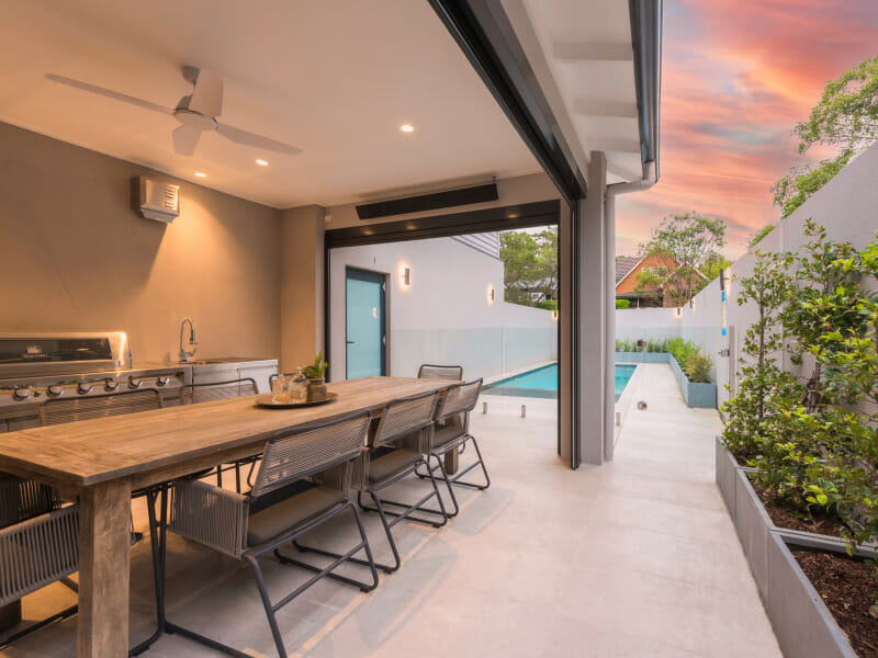 SlimWall boundary wall provides privacy for the outdoor kitchen and pool area