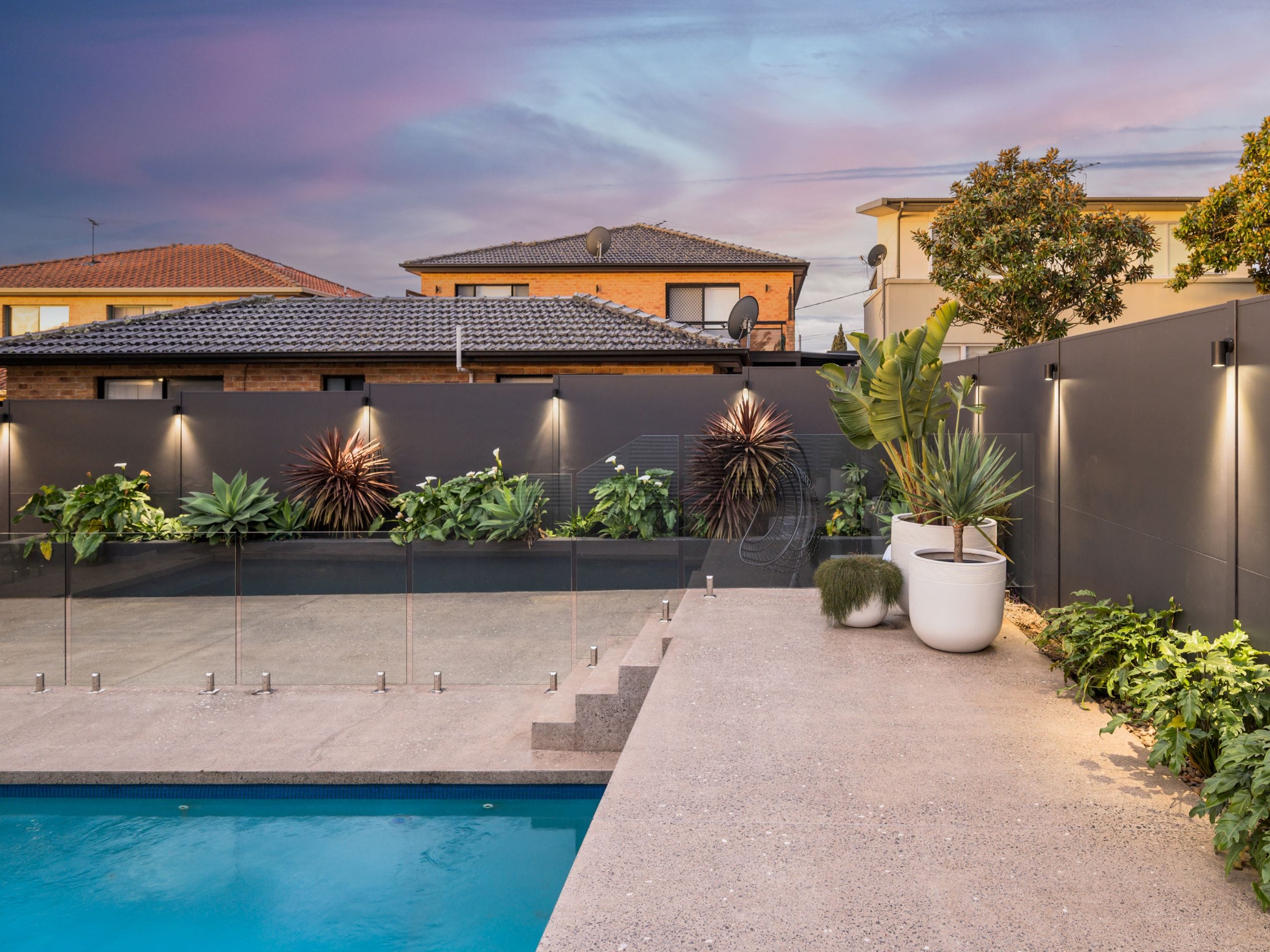 Pool feature walls can create a stunning backdrop for outdoor entertaining areas, helping define the space while adding privacy and visual interest.