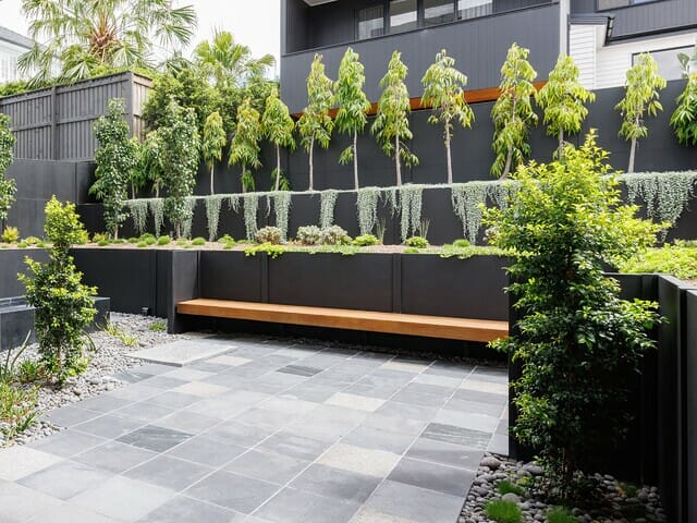 An integrated retaining wall fence gives a premium, high-end finish