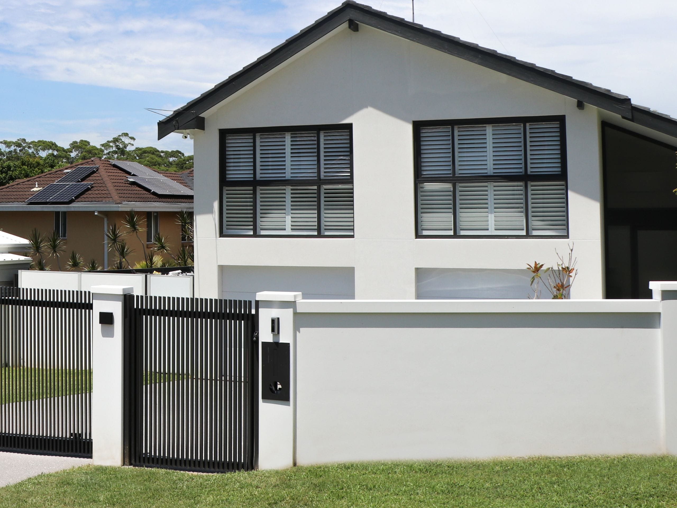 A letterbox is a great way to create a functional yet modern fence design