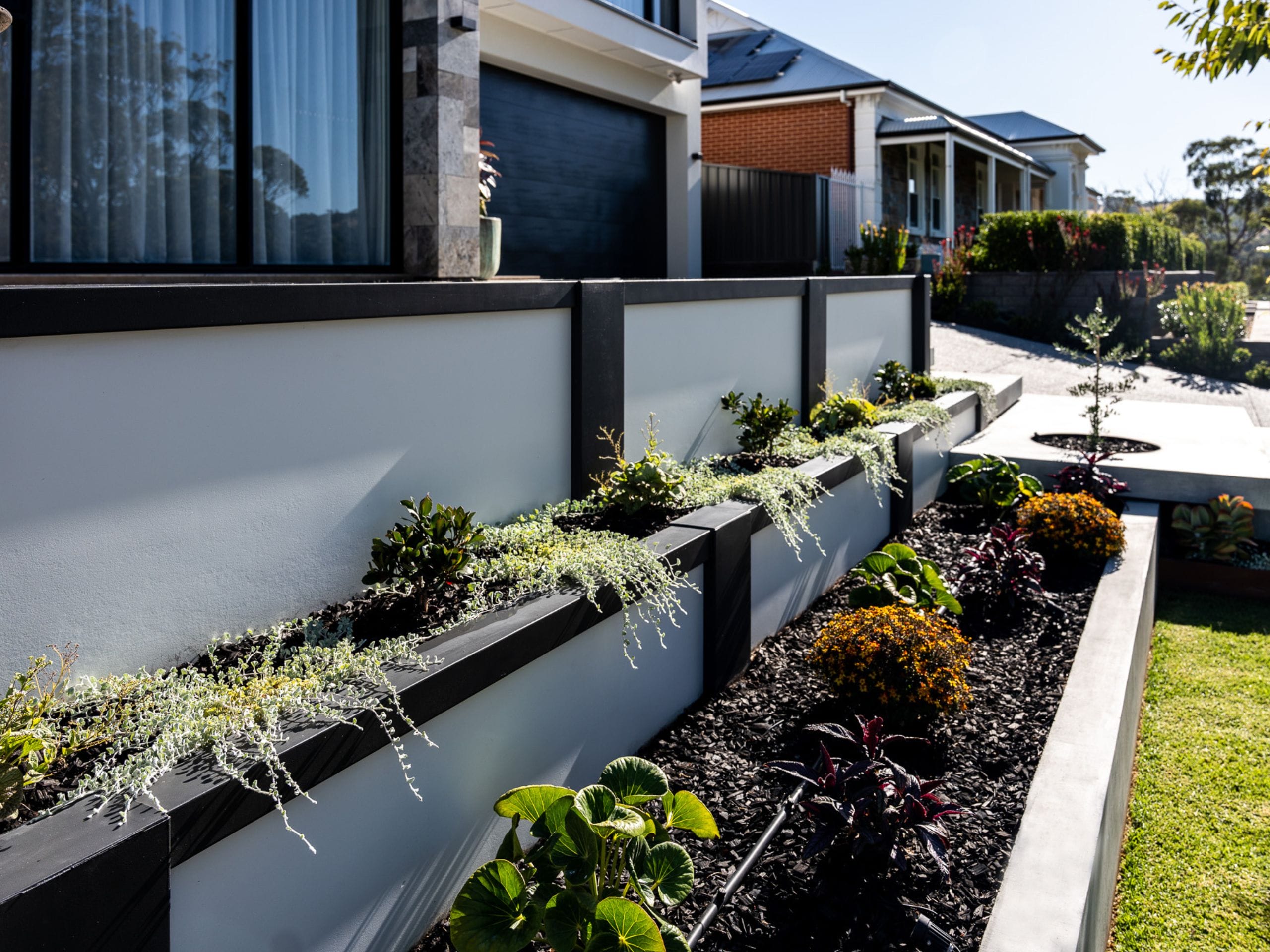 Create an abundance of colour by landscaping retaining walls 
