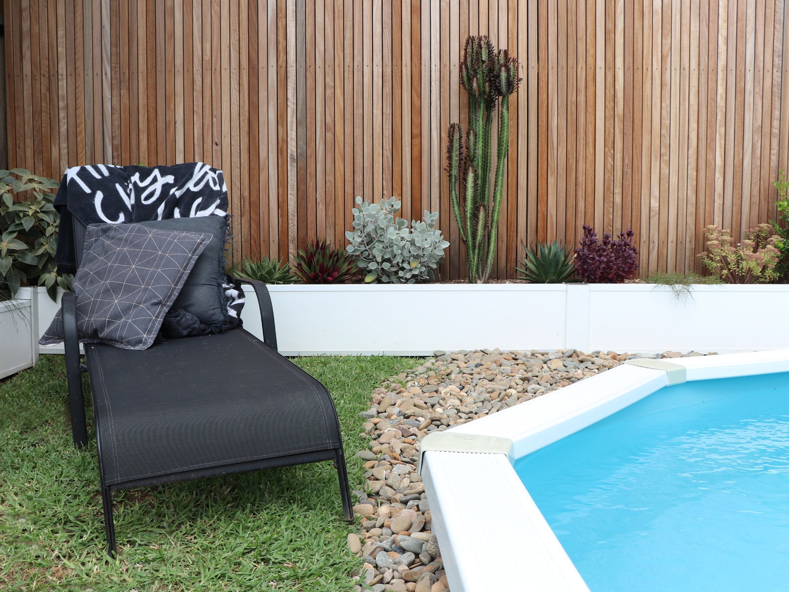 A small poolside retaining wall feature