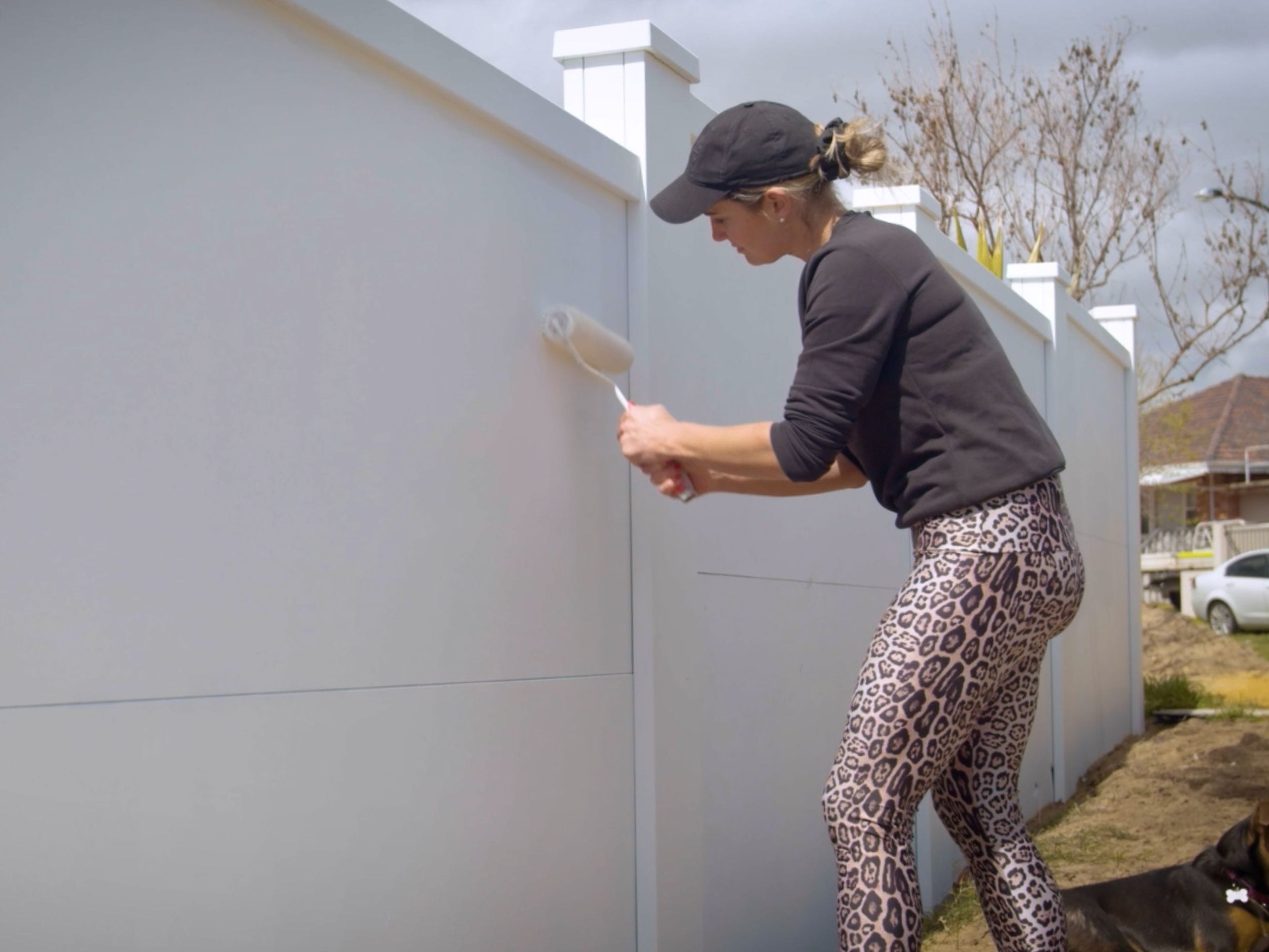 Elise painting her VogueWall in white