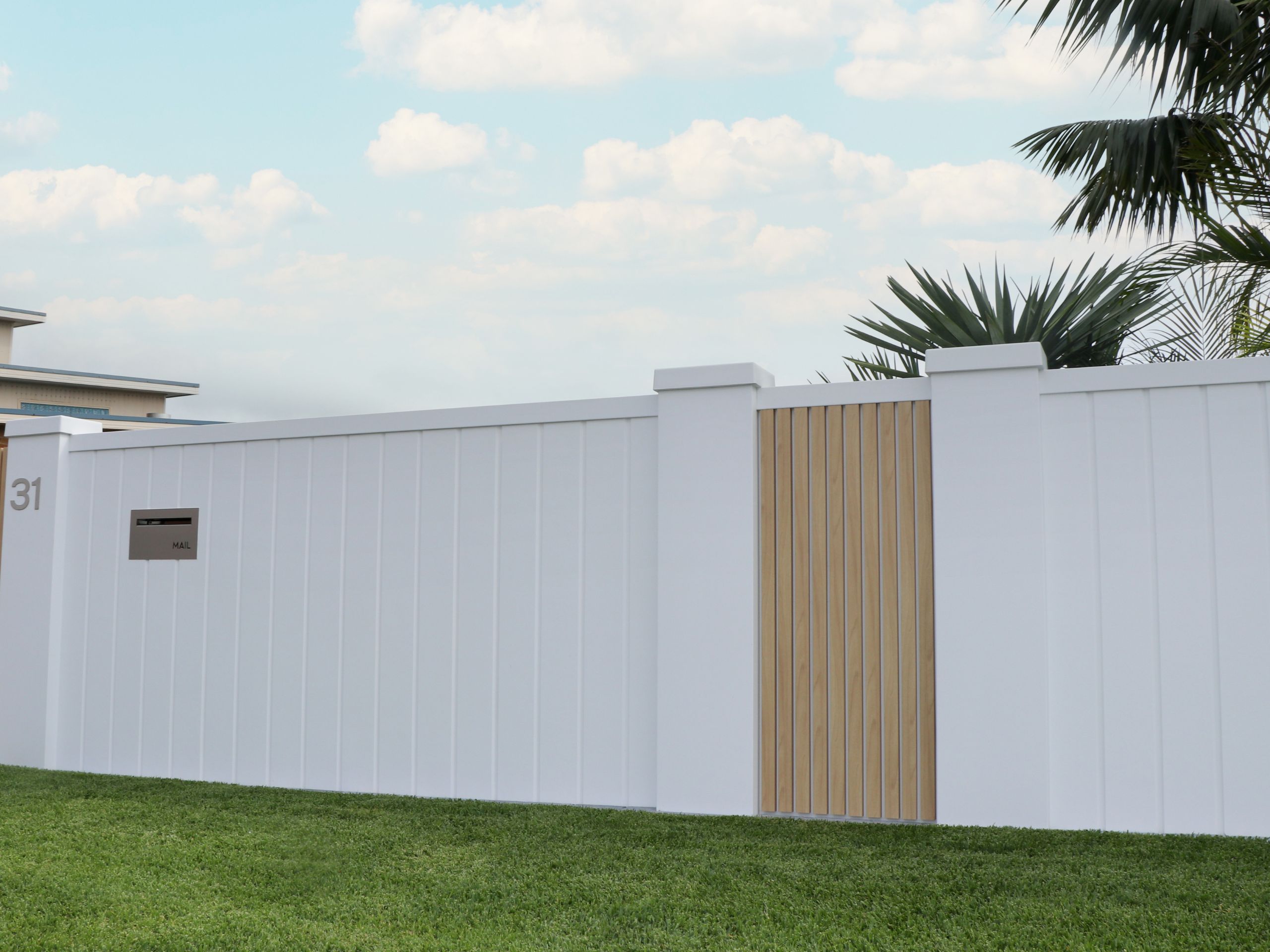 EstateWall Ffront wall with cladding creates a beachy landscaping aesthetic.