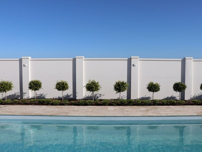 A stately, grand pool wall