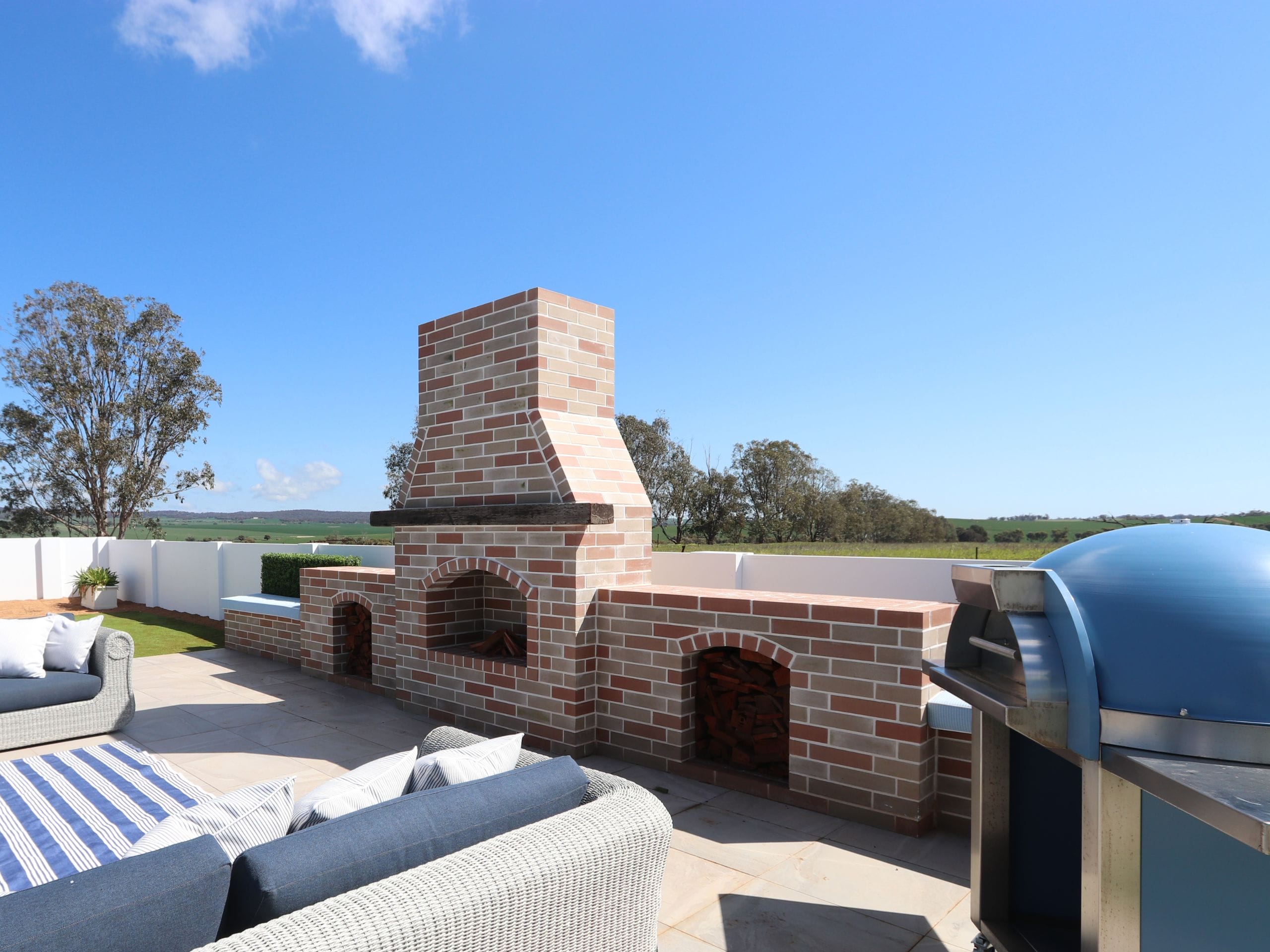 A wood-fire pizza oven is a high priority for many when undertaking a backyard remodel