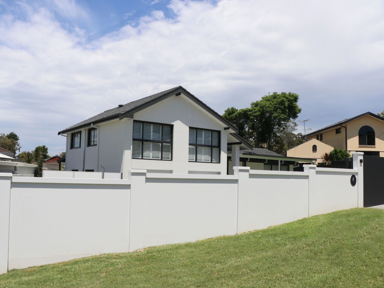 Modern front fence complements stunning renovation