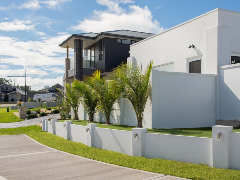 Front yard landscaping ideas: create a feature with a retaining wall and integrated lights