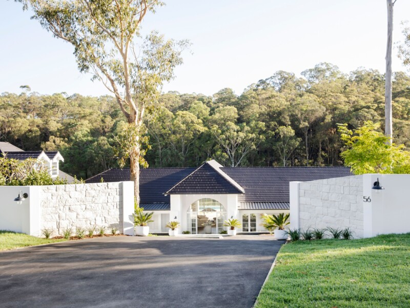 Grand driveway entrance with EstateWall with stone cladding and integrated lighting - Three Birds Renovations House 13