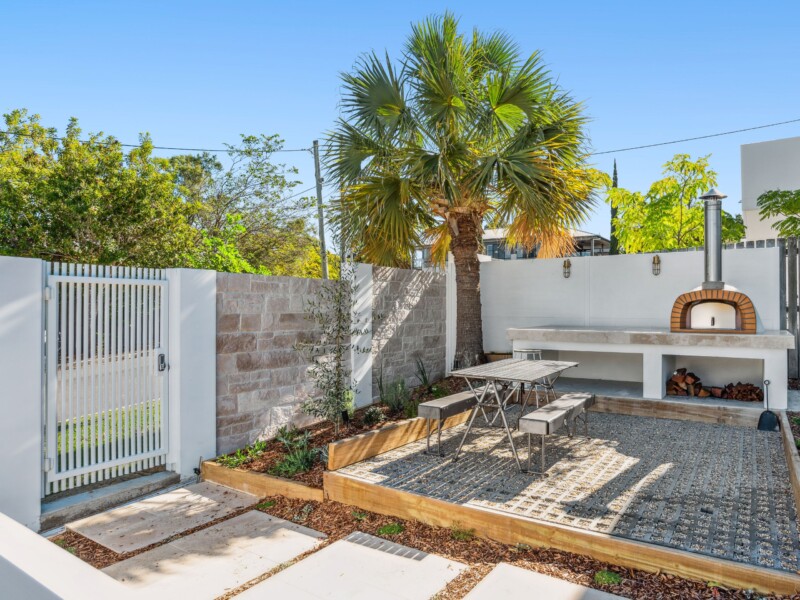 Front yard with dining setting and outdoor pizza oven