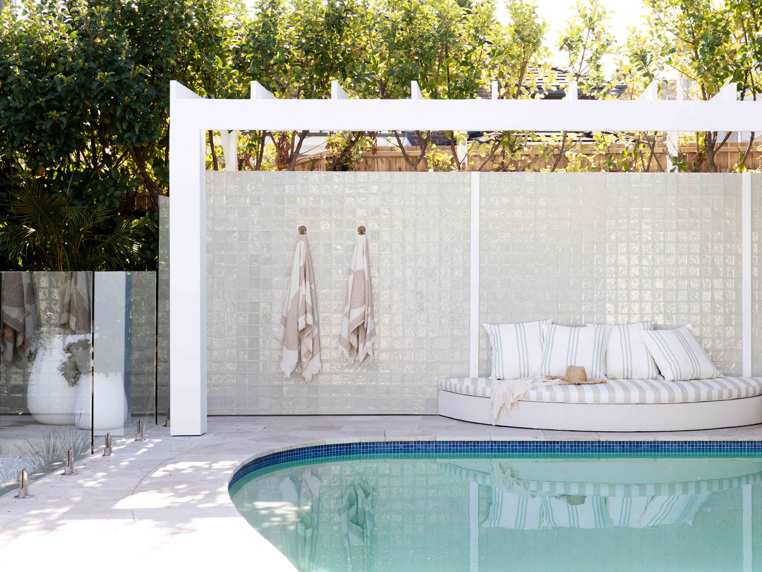 A tiled pool feature wall is a winner when it comes to pool area ideas