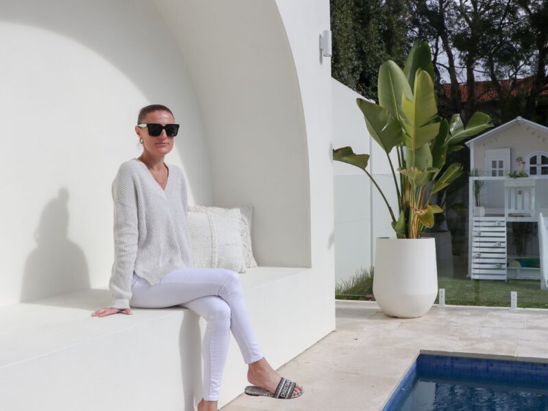 Alhana Friend in her pool area with a VogueWall boundary wall in the background