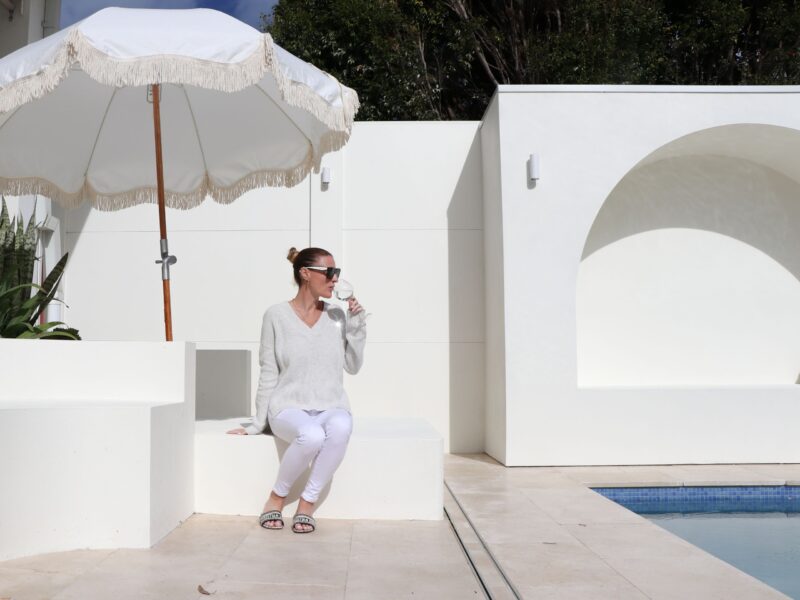 Alhana Friend enjoying her pool area with ModularWalls' VogueWall completing the modern Mediterranean aesthetic