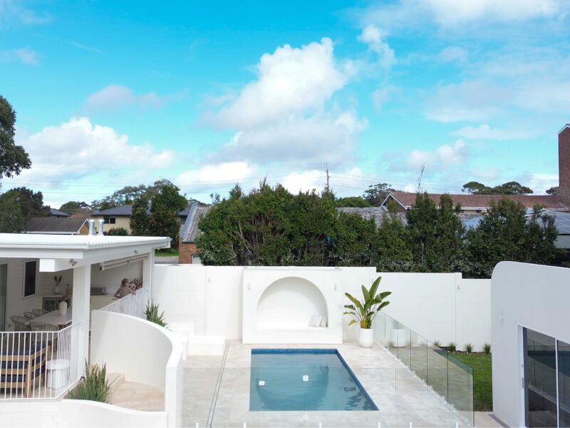 A modern Mediterranean backyard with a VogueWall boundary wall