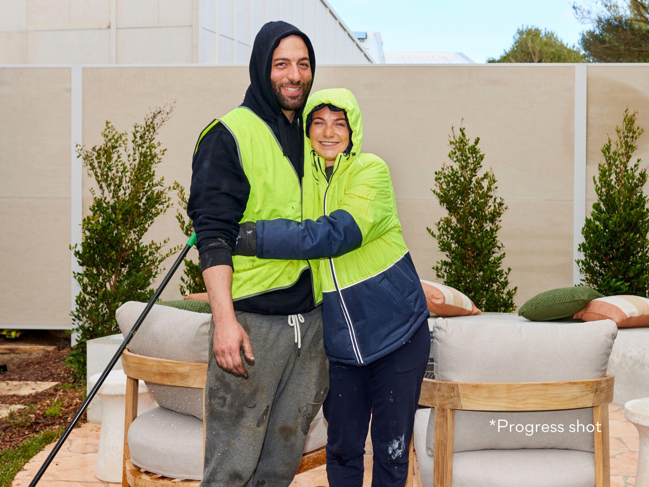 Courtney and Grant ready to paint their TrendWall boundary fence