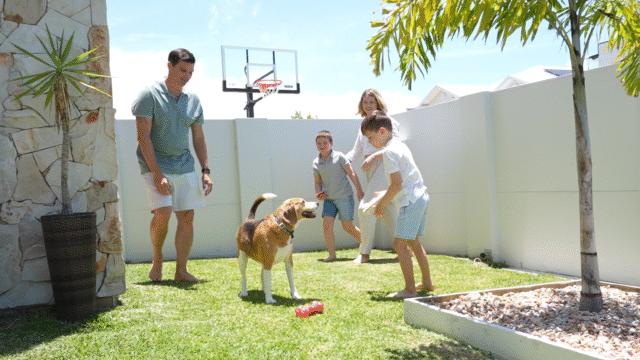 Shads of white family playing in front of VogueWall