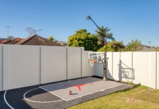 EstaeWall around backyard basketball court