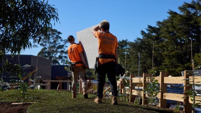 Block Staff Carrying A ModularWalls Panel