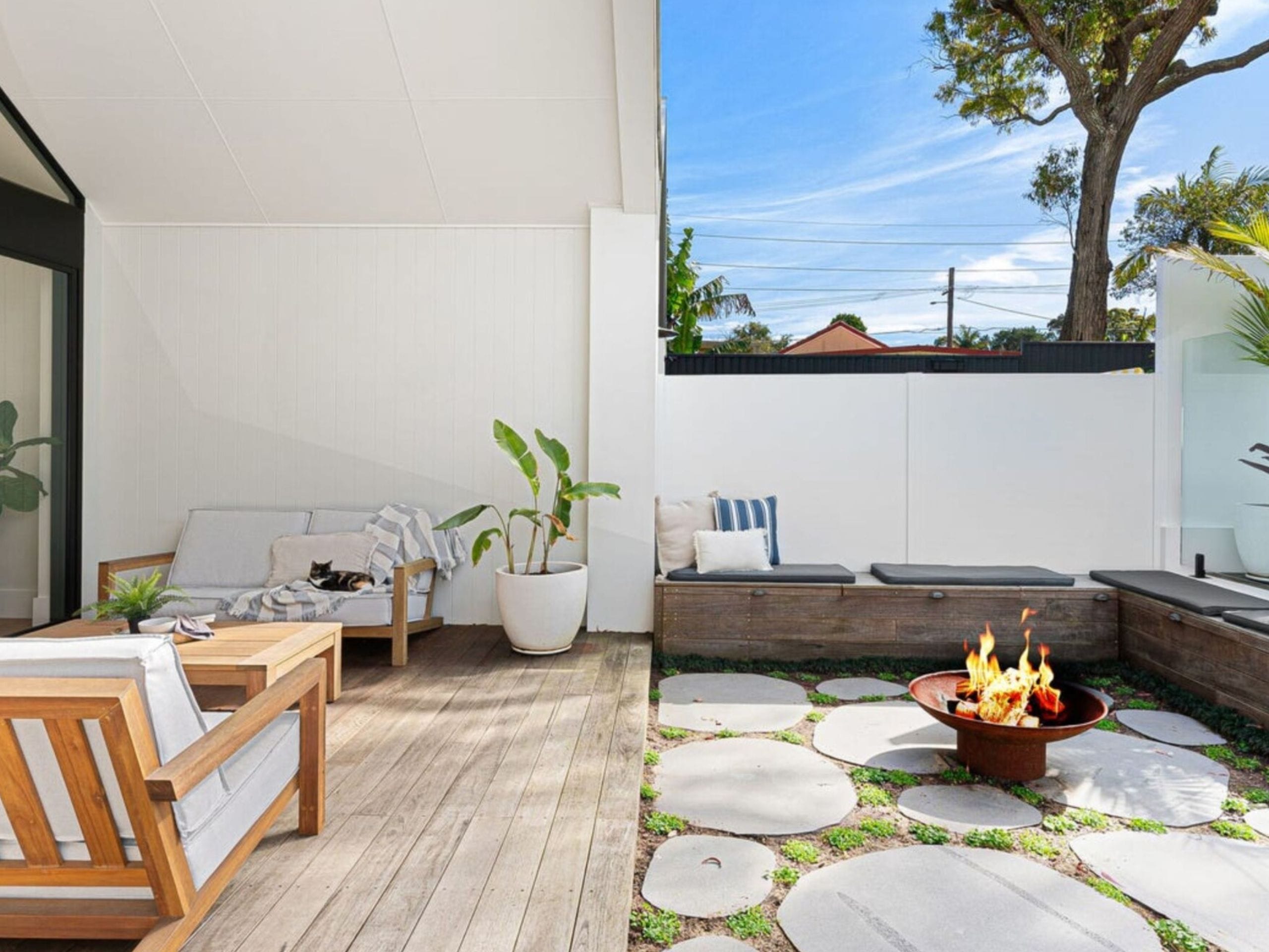 A DIY fire pit becomes a striking design feature for a backyard oasis 