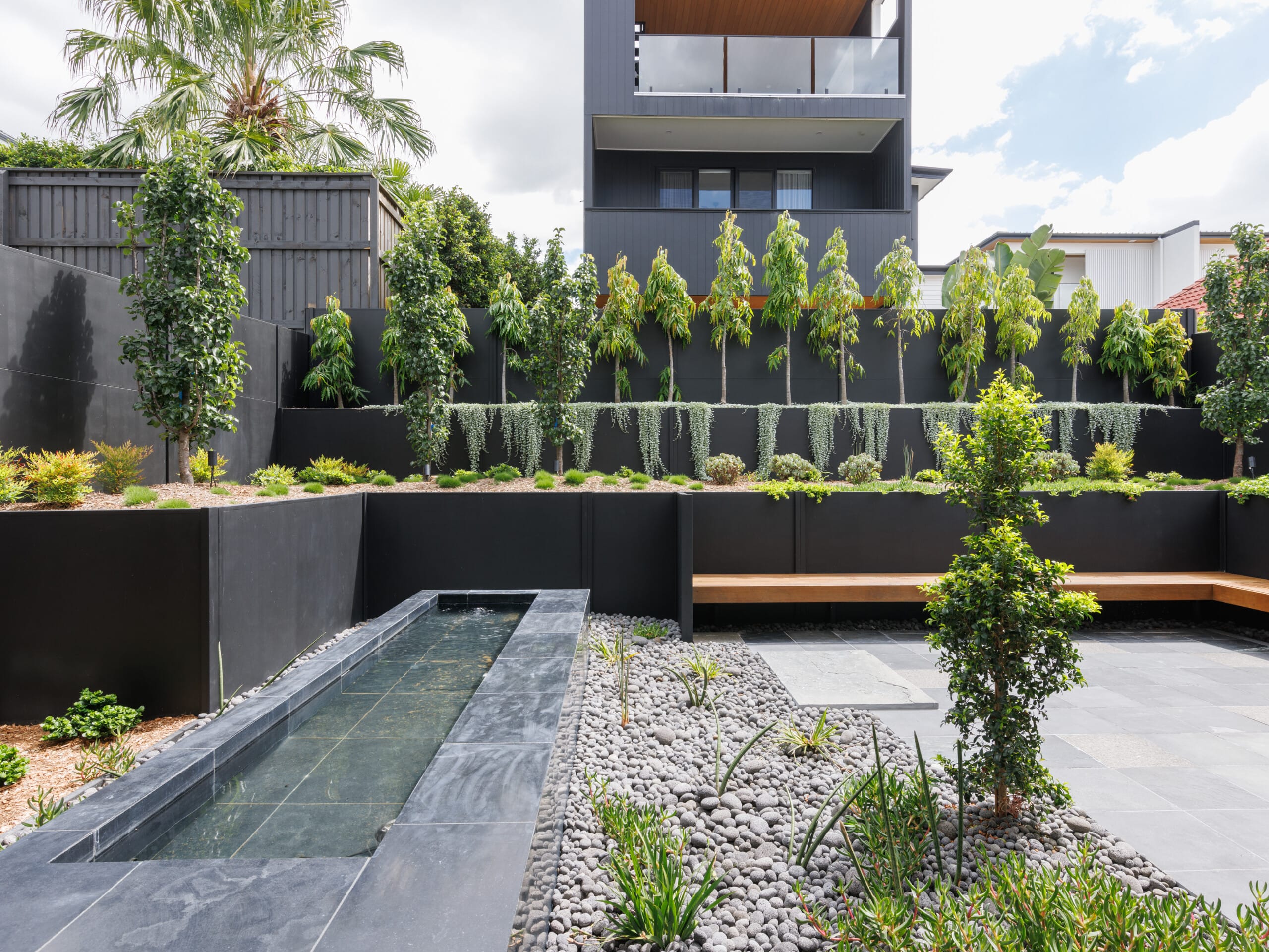 Level up your landscaping with a composite retaining wall