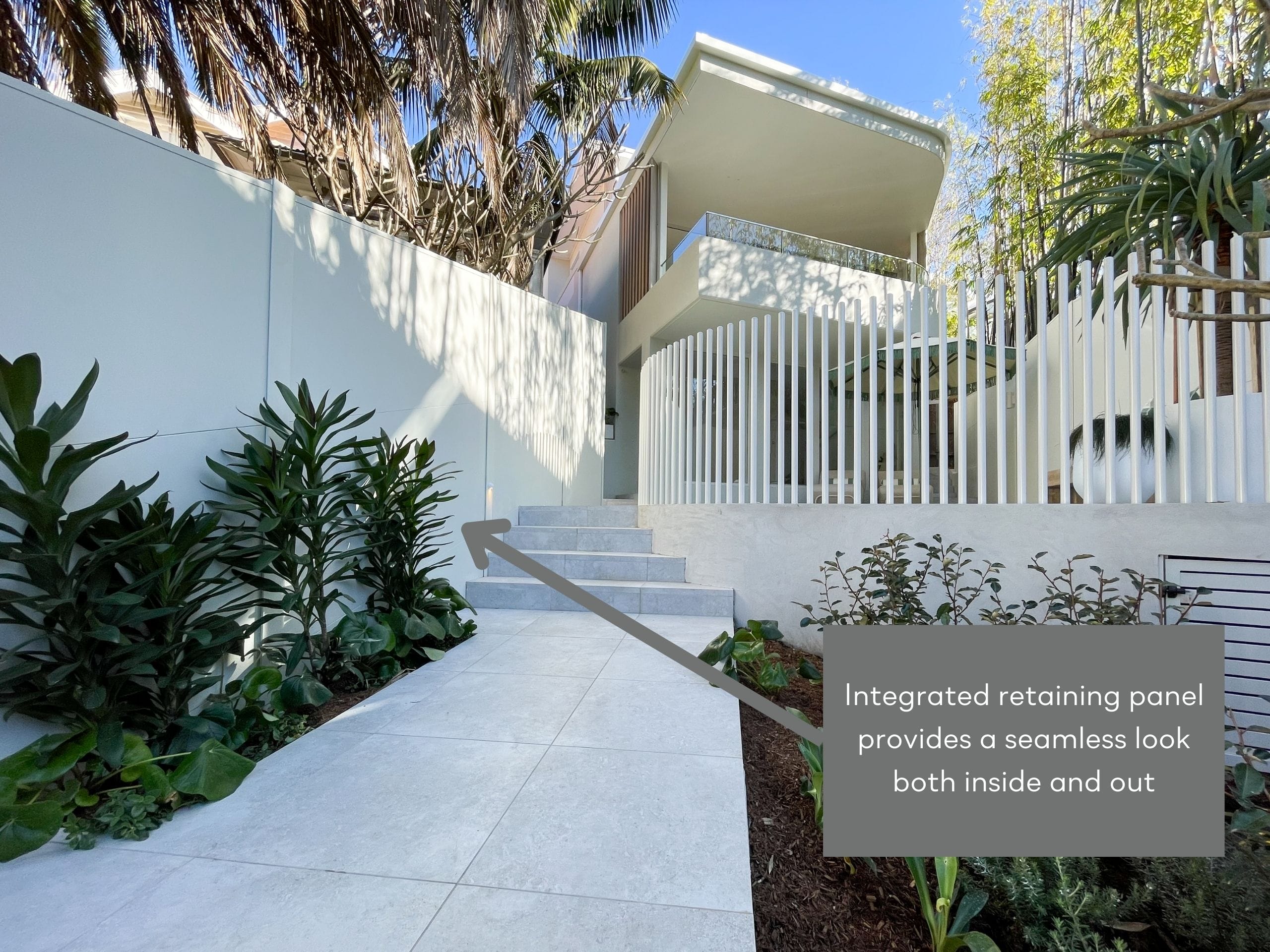 An integrated composite retaining wall and boundary fence will upgrade any space