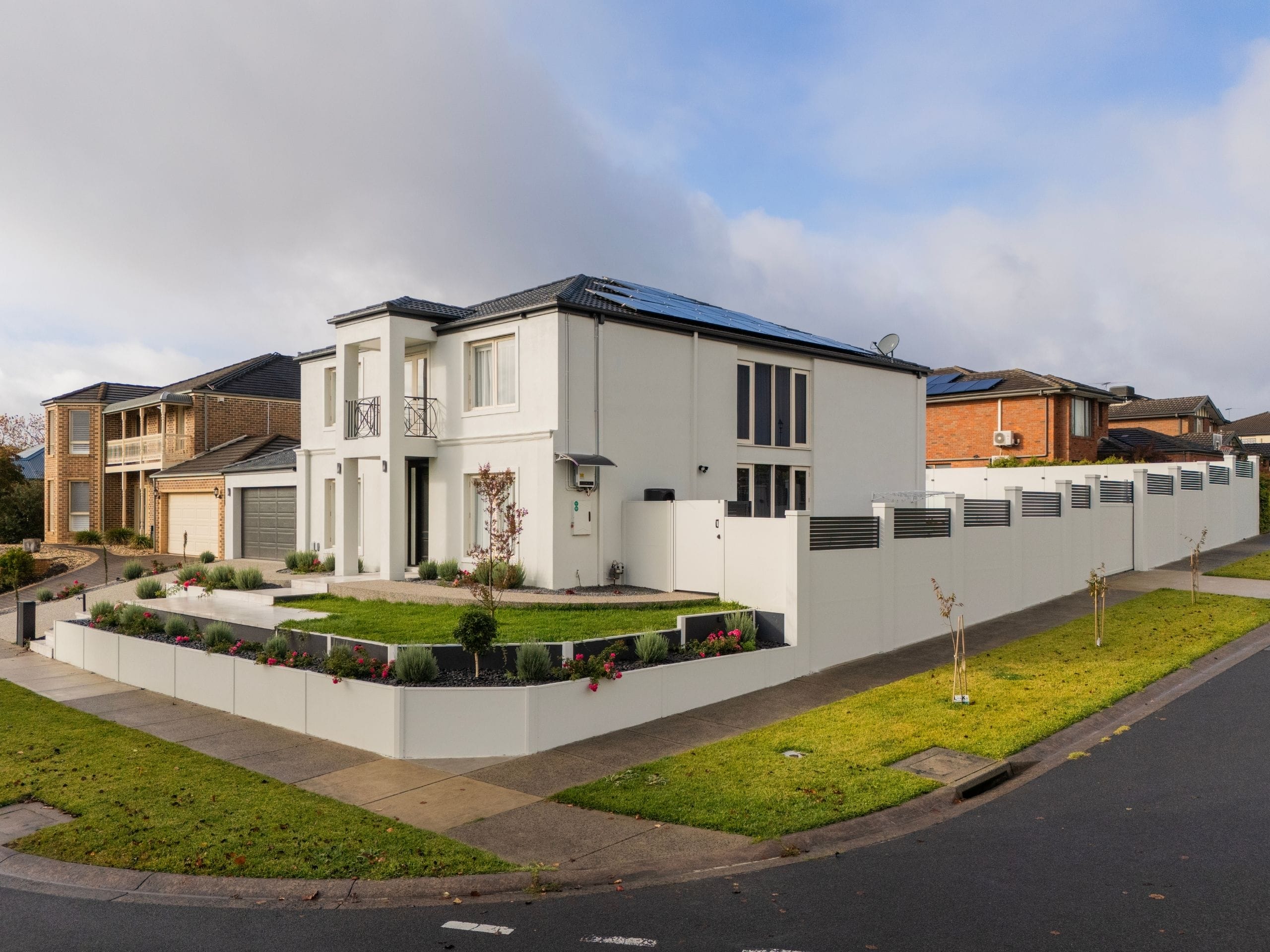 Using a combination of TerraFirm retaining panels with TrendWall and EstateWall fencing systems, the final result delivered both structural performance and strong street appeal.
