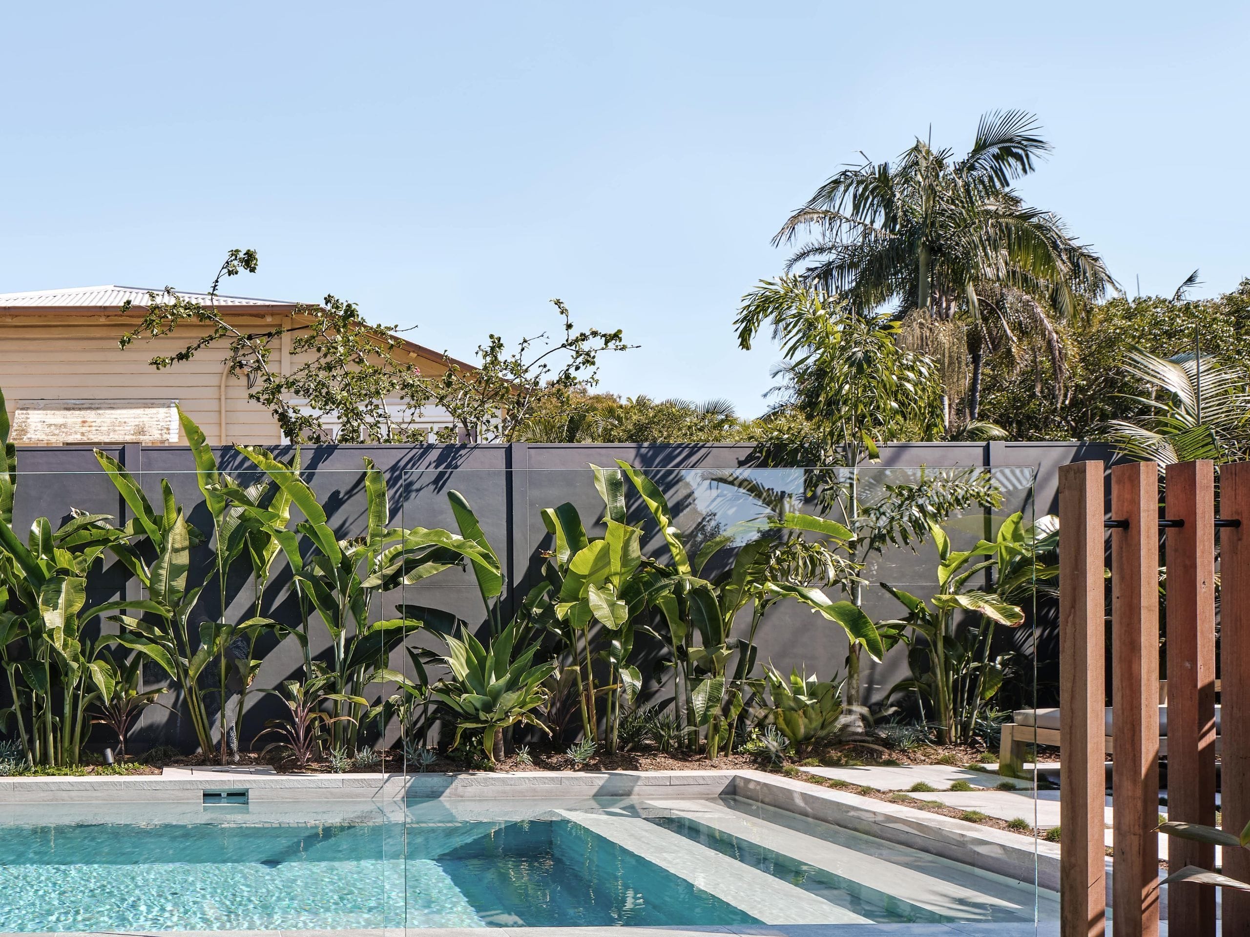 Layer hedges and potted plants for softer privacy for yard privacy ideas