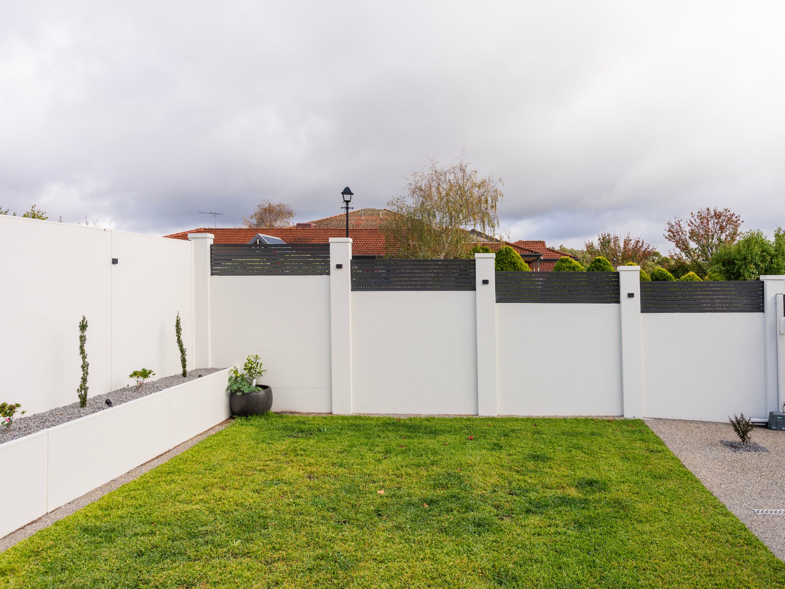 Integrated retaining is a great option for creating an on-trend fence