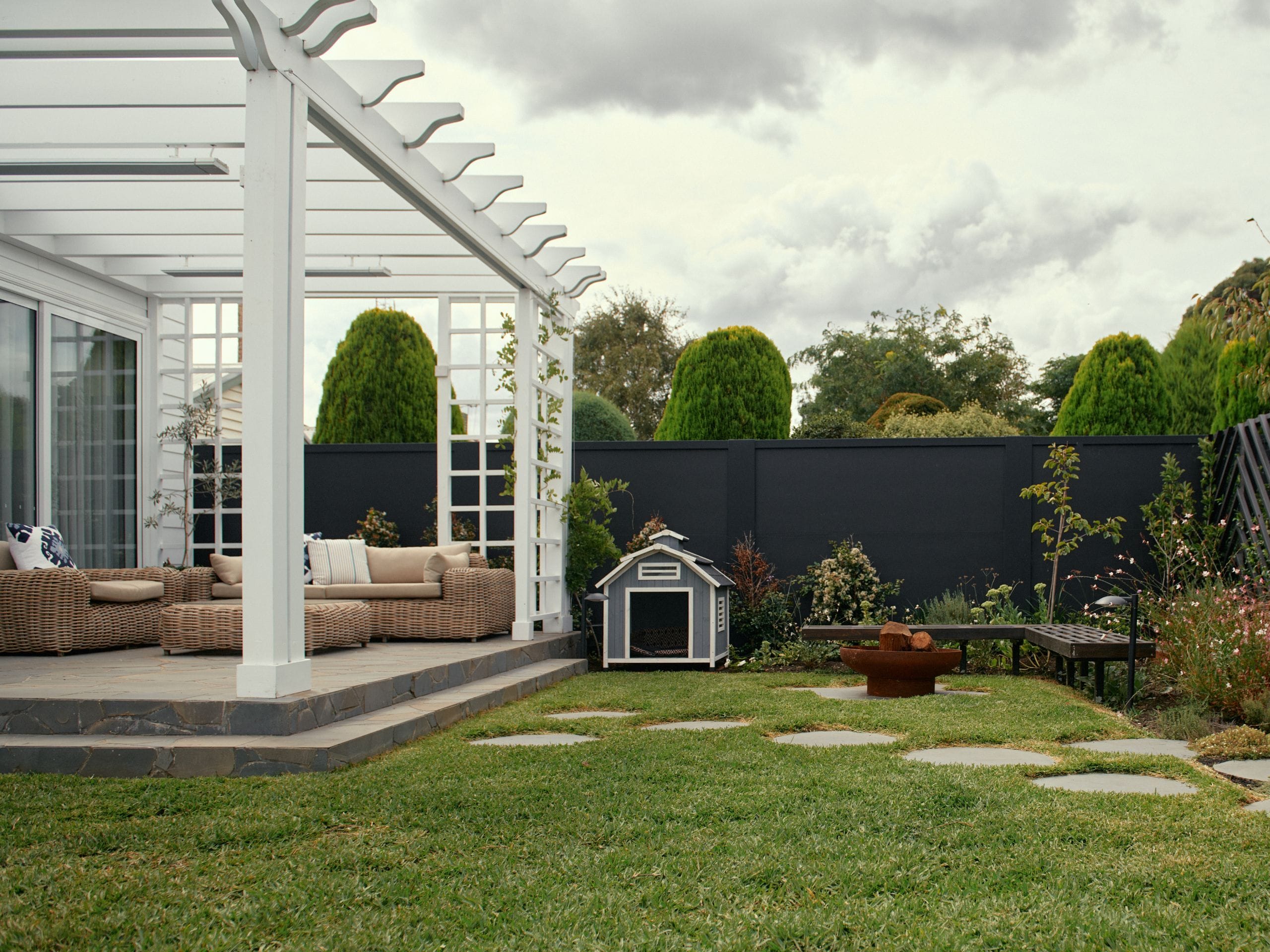 The first step in designing an inviting outdoor fire pit area is selecting a style that complements your home and landscape.