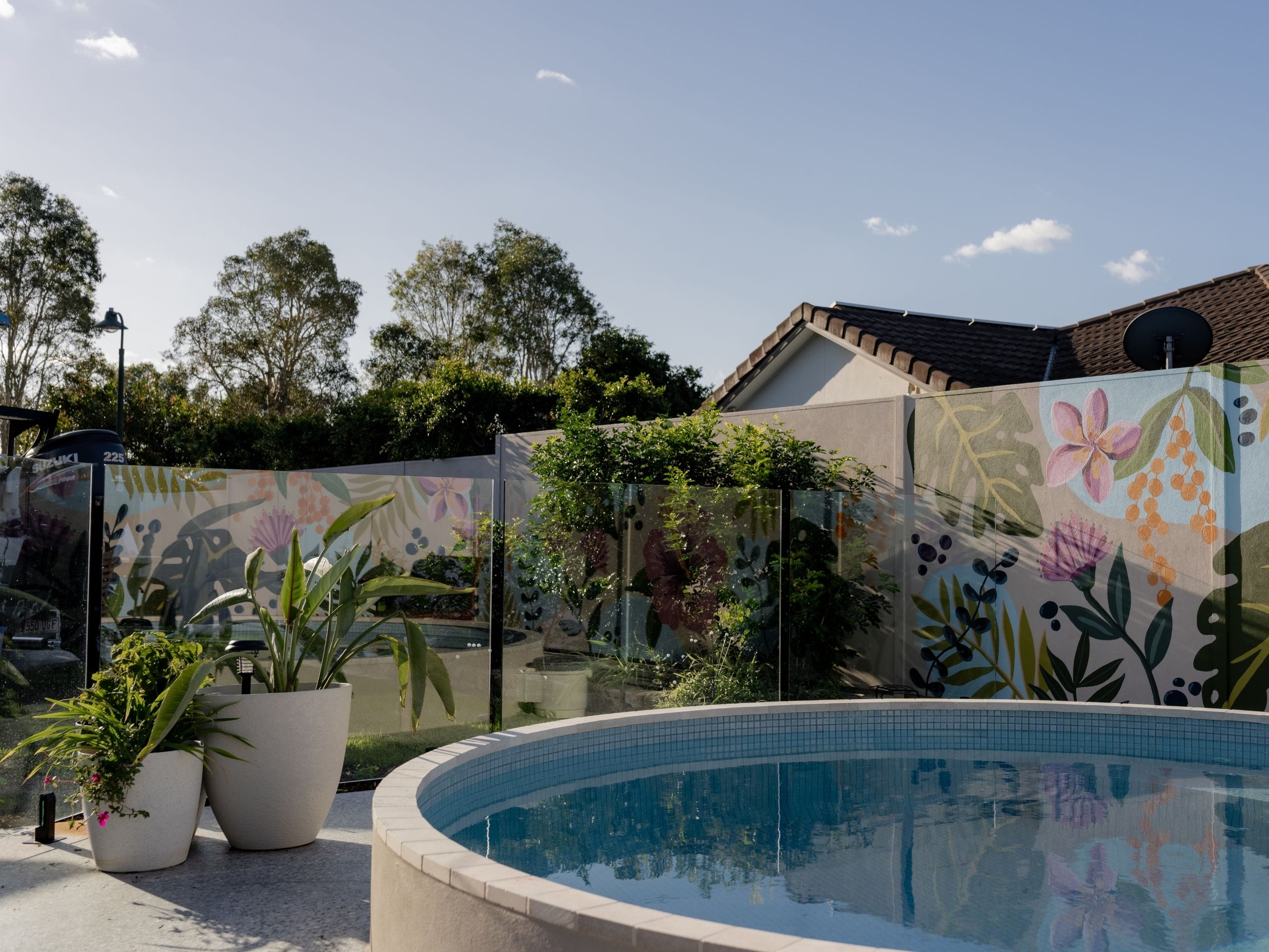 Brendan and Nichole's new pool feature wall defines their backyard, creating a beautiful, functional space where every day feels a little more like a tropical escape.