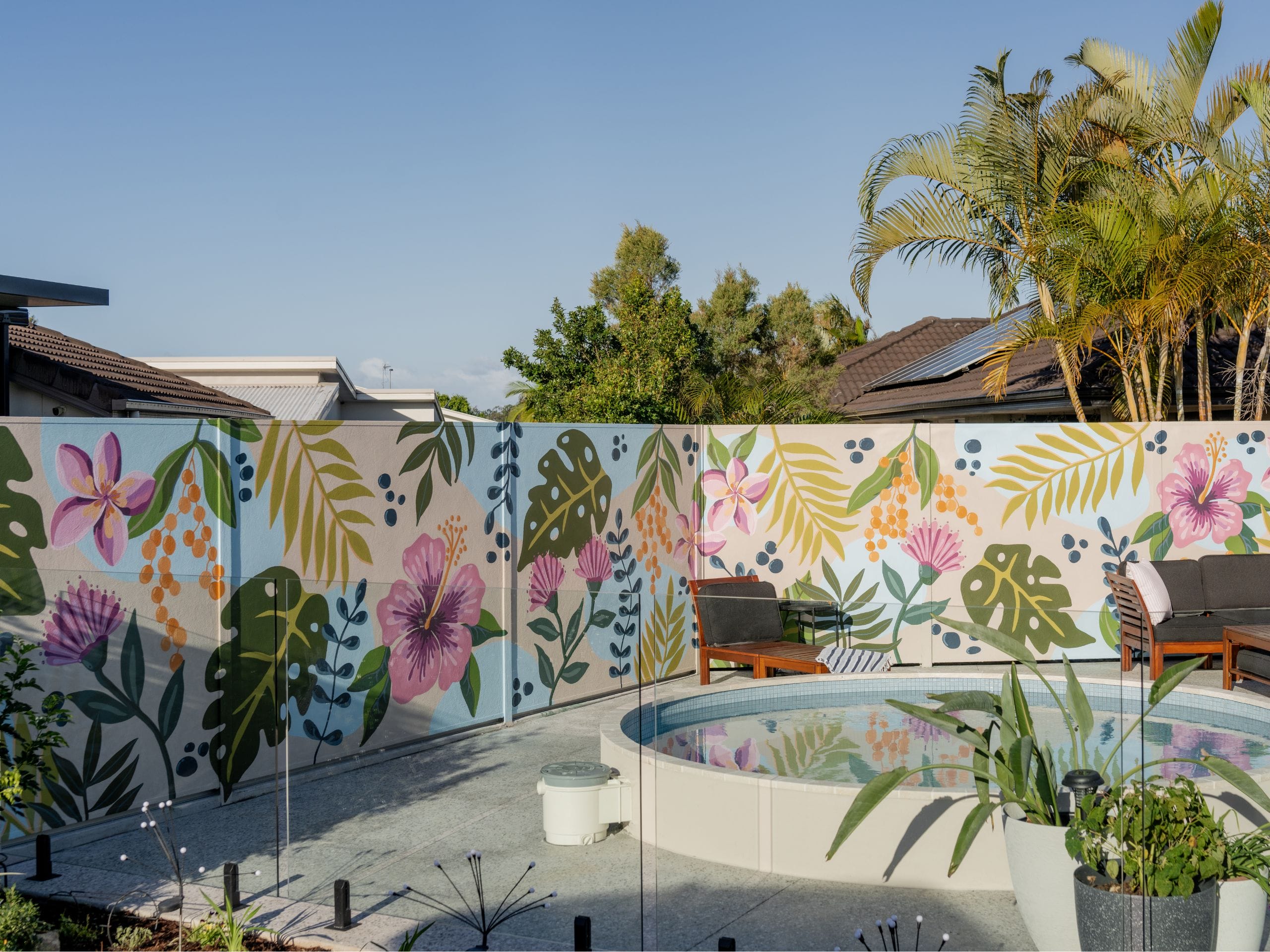 Here, a swimming pool feature wall became the perfect opportunity to bring a little piece of paradise home. Inspired by the Cook Islands, North Queensland and their local Sunshine Coast landscape, the couple transformed their smooth SlimWall® into a vibrant tropical mural.