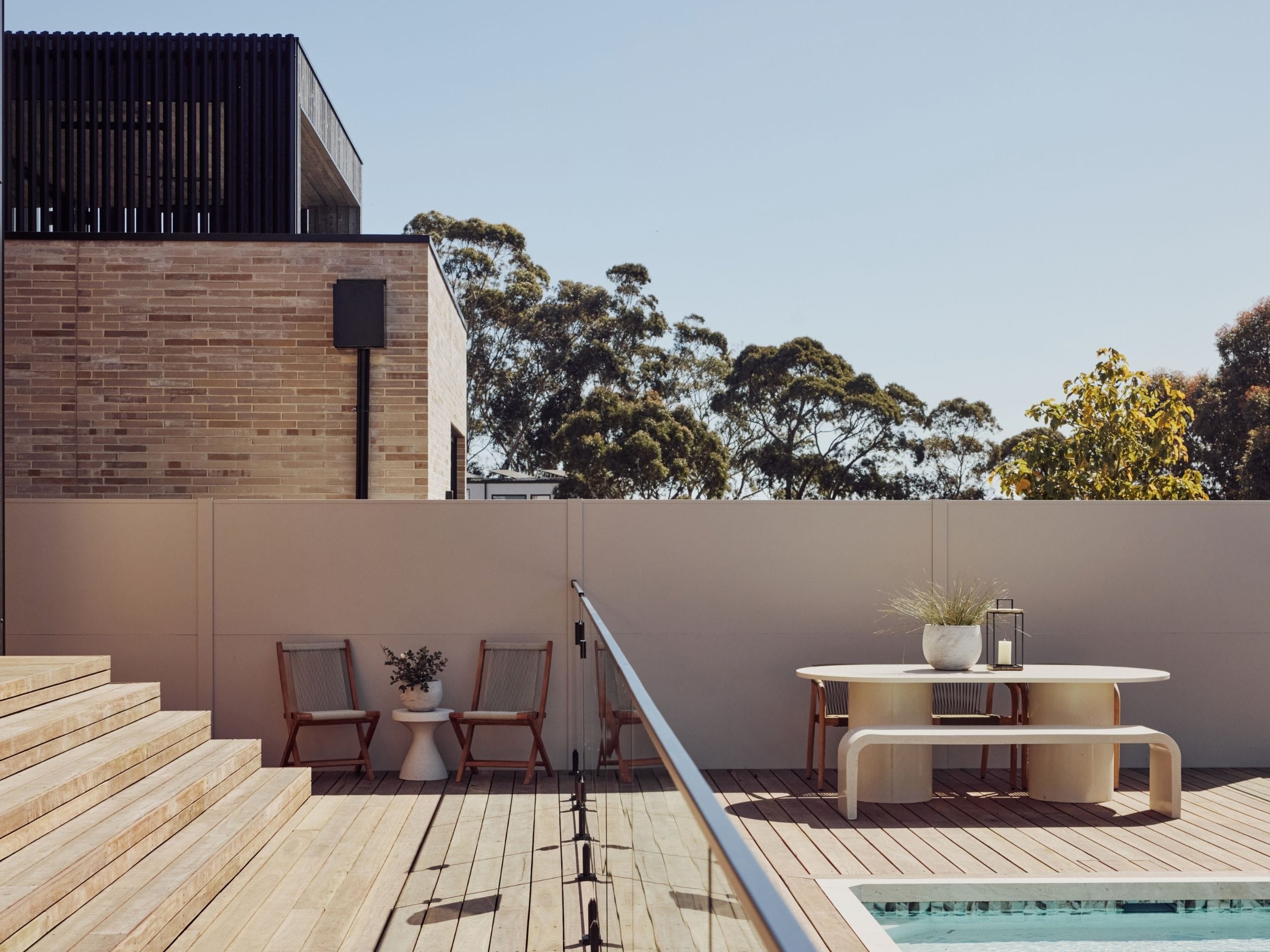 Here, the light poolside wall provides a simple background for the planting and furniture. Its understated finish lets the textures and styling lead, helping Chantel and Wyatt’s outdoor area feel relaxed and cohesive.