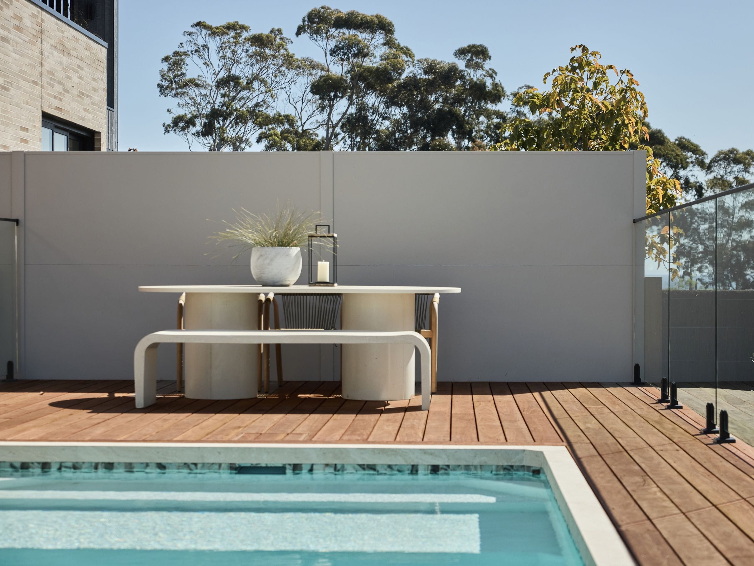 Arches, rounded furniture and curved forms soften the modern spaces seen throughout the season.